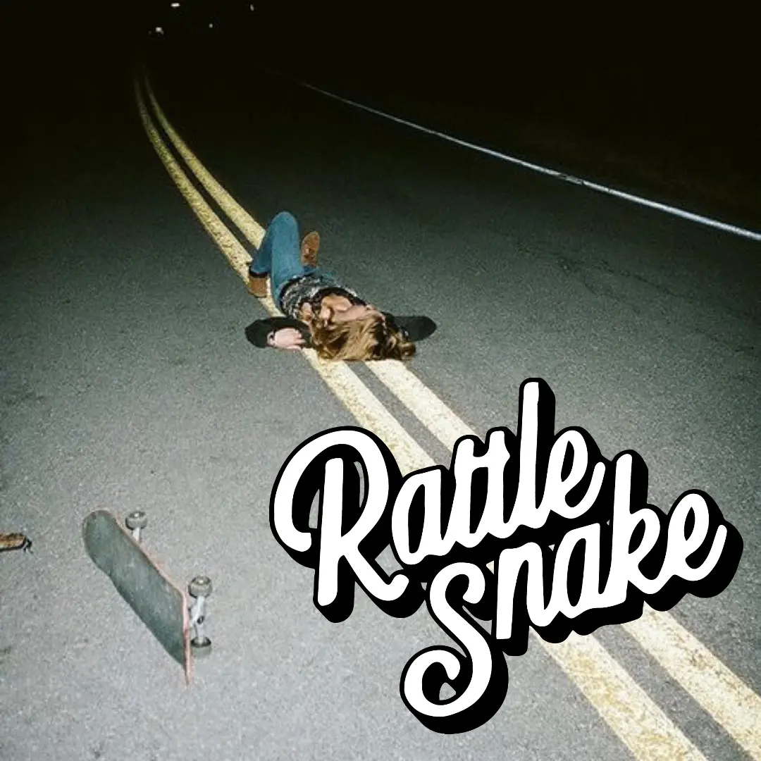 Rattlesnake wordmark over night road photograph
